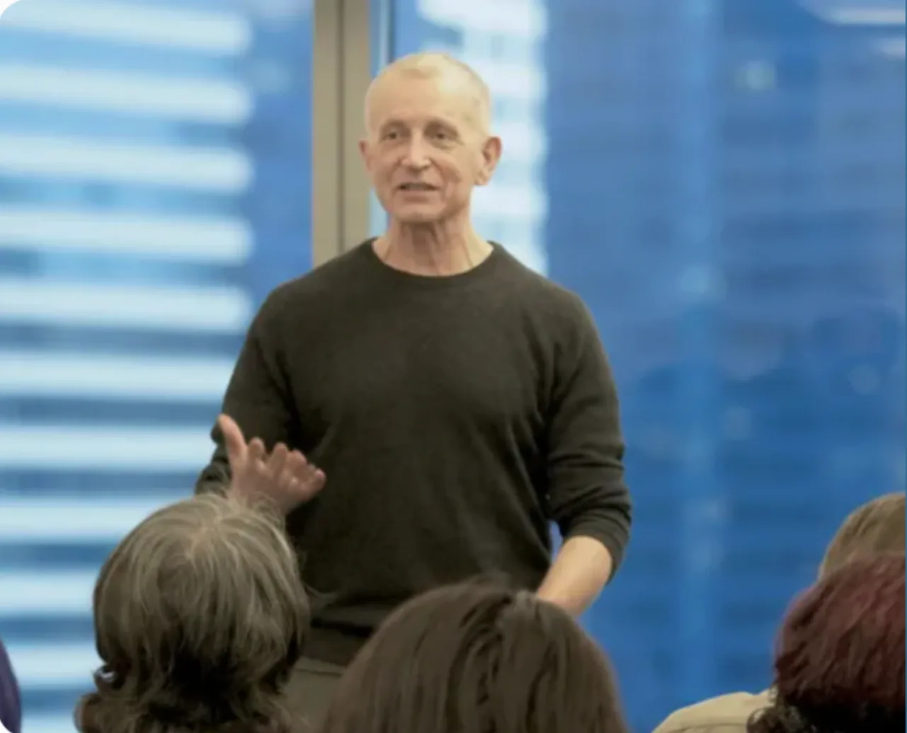 Rod Francis leading a workshop session with a seated group